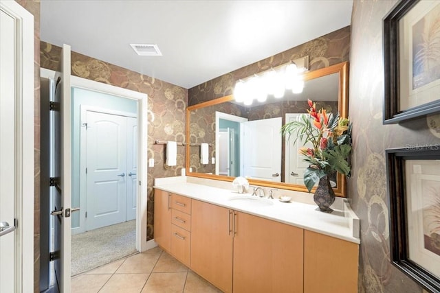 bathroom featuring tile patterned flooring and vanity