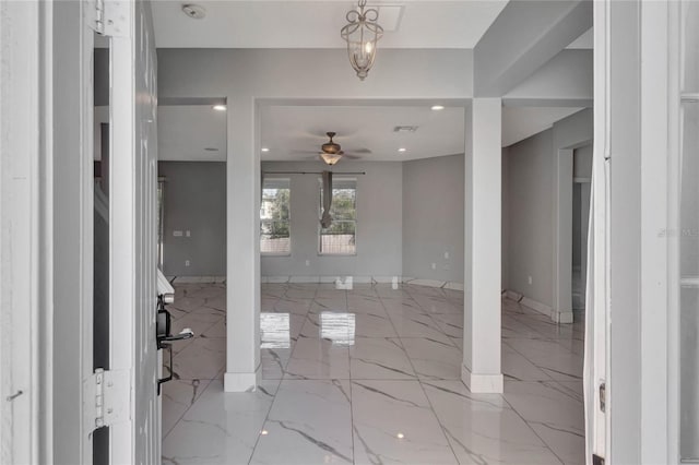 entrance foyer with ceiling fan