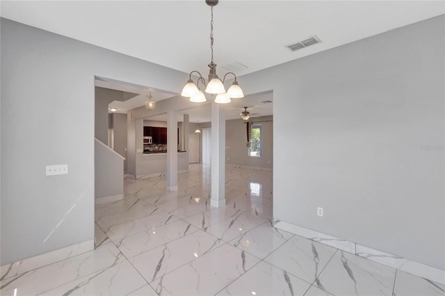 unfurnished dining area with ceiling fan with notable chandelier