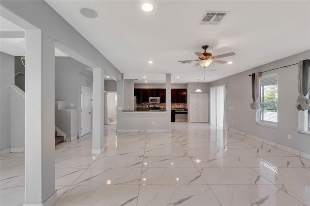 unfurnished living room featuring ceiling fan