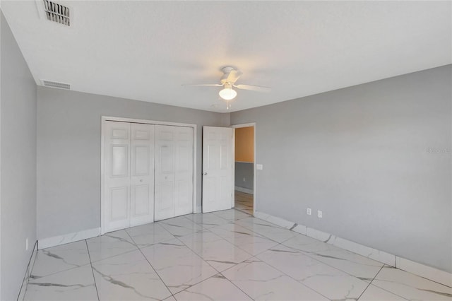 unfurnished bedroom featuring a closet and ceiling fan