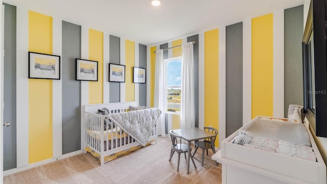 carpeted bedroom with a crib