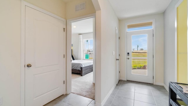 interior space with light tile patterned floors