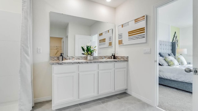 bathroom featuring tile patterned floors and vanity