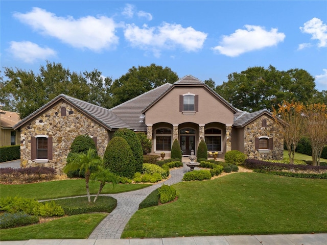 view of front of home featuring a porch and a front lawn