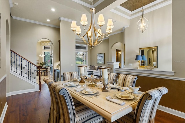 dining room with crown molding, dark hardwood / wood-style floors, and a notable chandelier