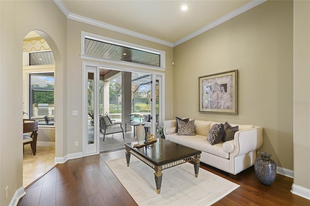 living room featuring ornamental molding and dark wood-type flooring