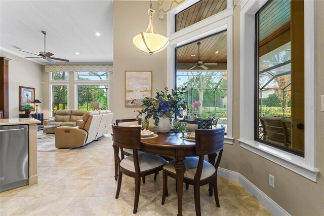 dining space featuring plenty of natural light and light tile patterned floors