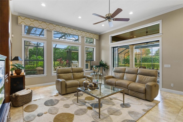 tiled living room featuring a wealth of natural light, ceiling fan, and ornamental molding