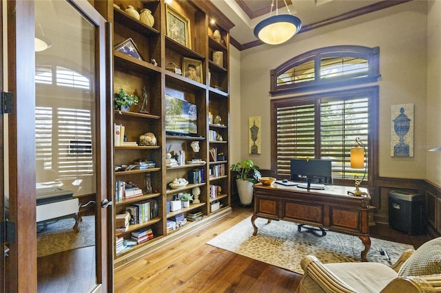 home office featuring crown molding and light wood-type flooring