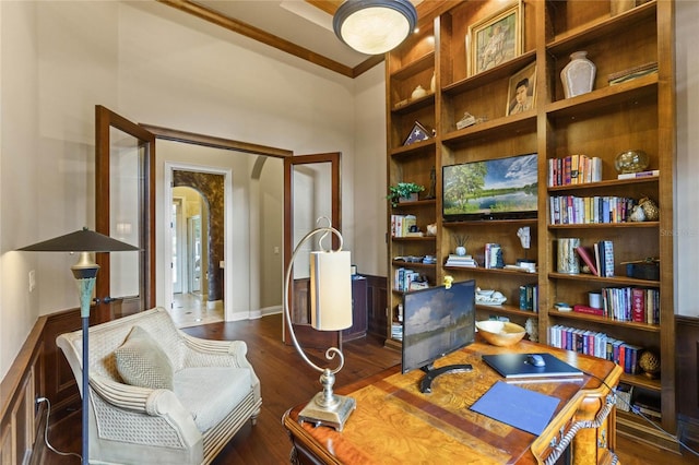 office area featuring crown molding and dark wood-type flooring