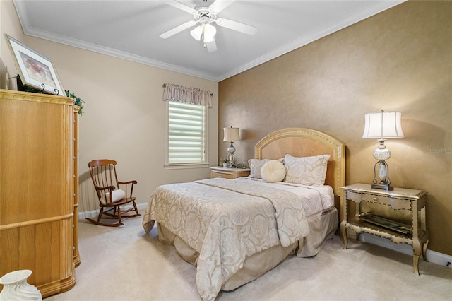 carpeted bedroom featuring ceiling fan and crown molding