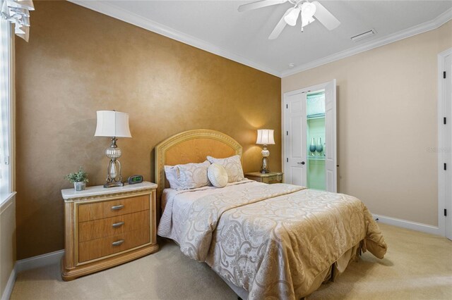 bedroom with crown molding, ceiling fan, and light carpet