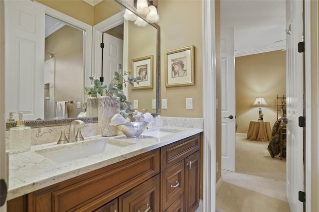 bathroom featuring vanity and ornamental molding