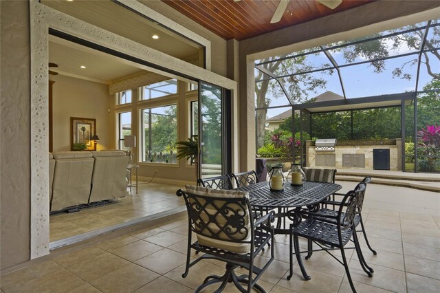 sunroom with ceiling fan and wood ceiling