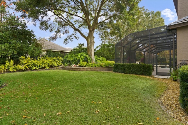 view of yard with glass enclosure