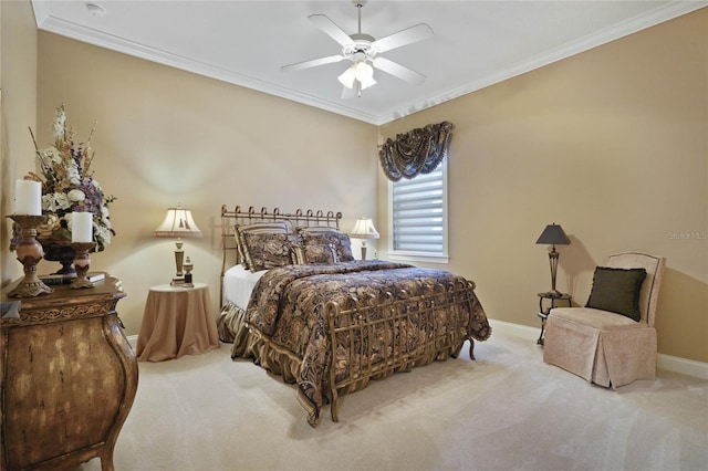 carpeted bedroom featuring ceiling fan and ornamental molding