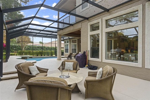 view of patio featuring a lanai and a grill