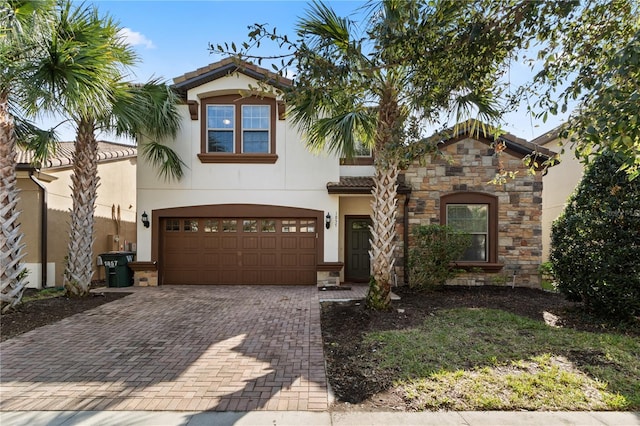 mediterranean / spanish house with a garage