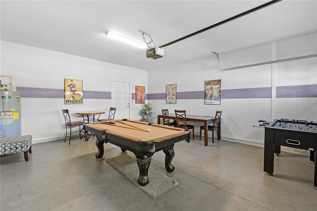 rec room featuring electric water heater, concrete flooring, and pool table