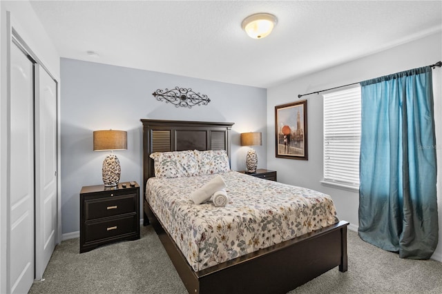 bedroom featuring a closet and carpet floors