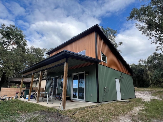 back of house with a patio area