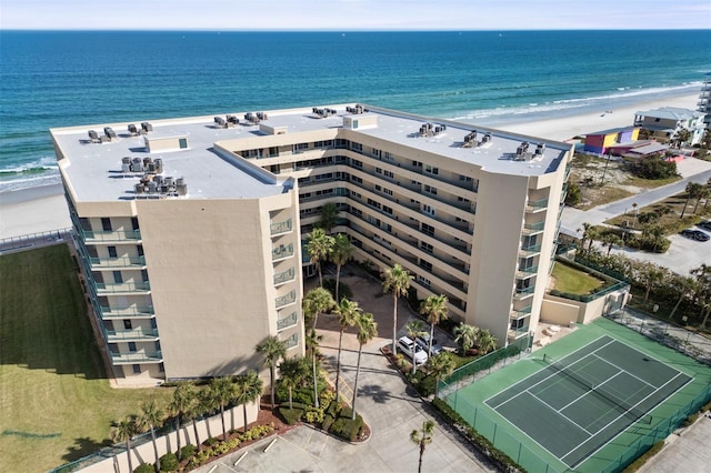 bird's eye view with a water view and a beach view