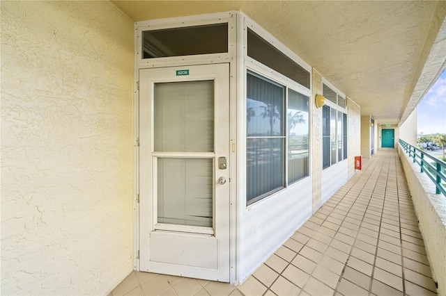 entrance to property featuring a balcony