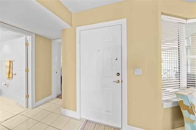 entrance foyer with light tile patterned floors