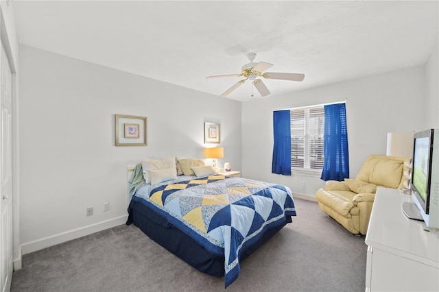 carpeted bedroom featuring ceiling fan and a closet