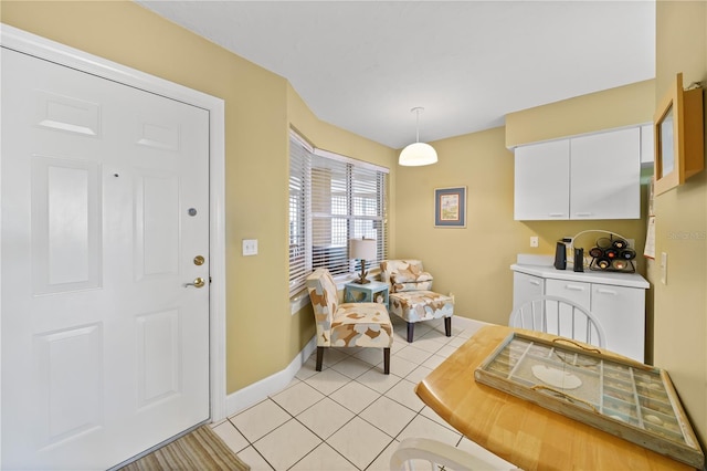 dining area featuring light tile patterned flooring