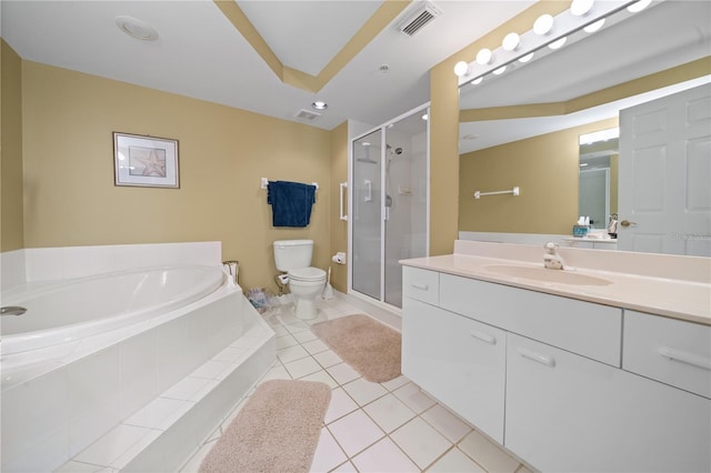 full bathroom featuring tile patterned flooring, vanity, independent shower and bath, and toilet