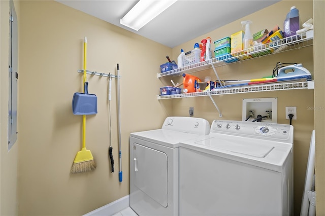 laundry area featuring tile patterned floors and washer and dryer