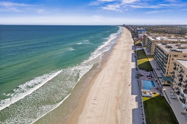 aerial view featuring a water view and a beach view