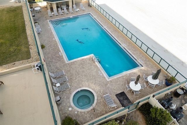 view of pool with a community hot tub