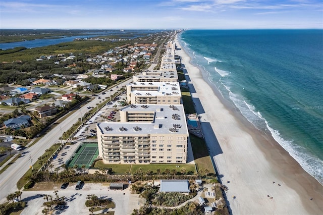 bird's eye view featuring a water view and a beach view