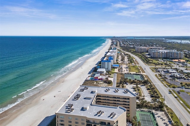 drone / aerial view with a water view and a view of the beach