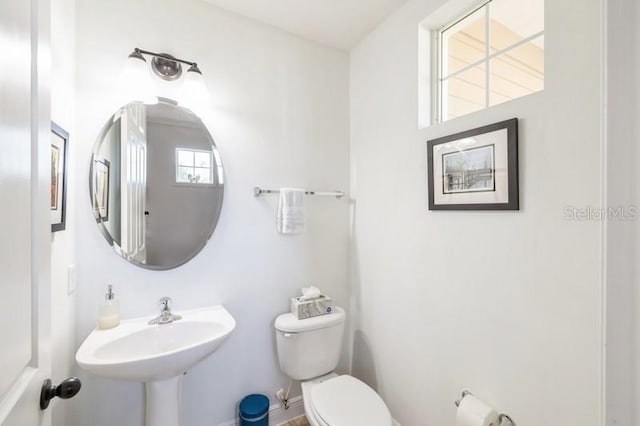 bathroom with toilet and sink