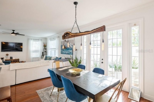 dining area with french doors, hardwood / wood-style flooring, plenty of natural light, and ceiling fan