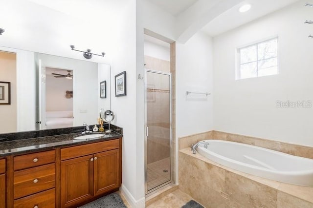 bathroom with vanity, separate shower and tub, and ceiling fan