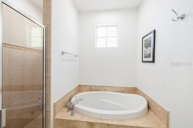 bathroom with shower with separate bathtub