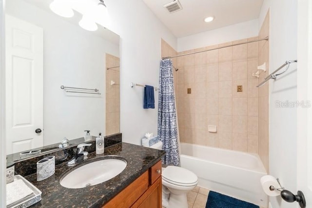 full bathroom featuring tile patterned flooring, vanity, shower / tub combo, and toilet