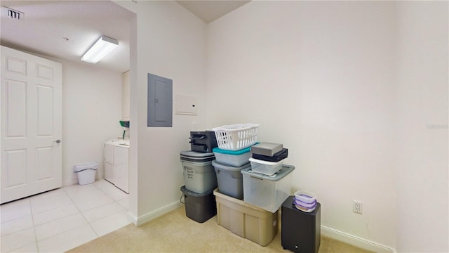 laundry room with washer and dryer, electric panel, and light colored carpet