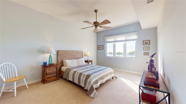 bedroom featuring light carpet and ceiling fan