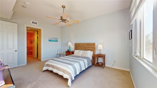 bedroom with ceiling fan and light colored carpet