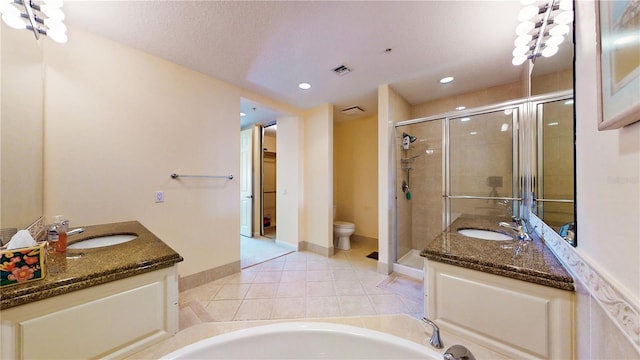 full bathroom featuring tile patterned flooring, vanity, toilet, and plus walk in shower