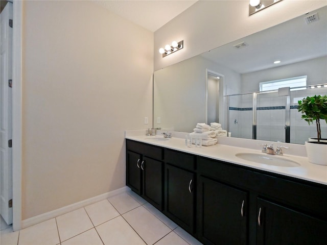 bathroom with vanity, tile patterned floors, and walk in shower