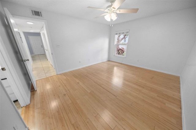 unfurnished room featuring ceiling fan and light wood-type flooring