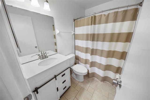 bathroom with tile patterned floors, curtained shower, vanity, and toilet