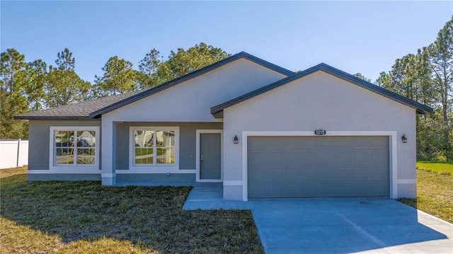 ranch-style house with a front yard and a garage